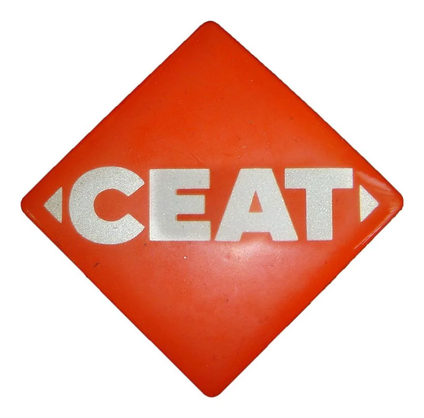 Orange CEAT diamond dome label with reflective white lettering