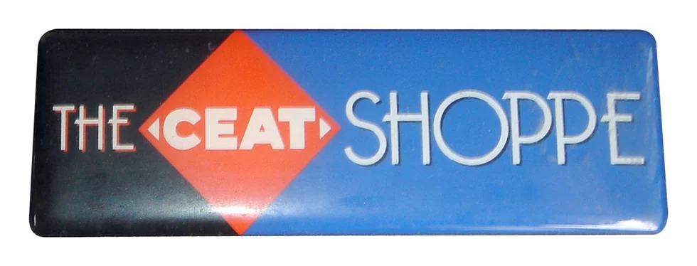 The CEAT Shoppe rectangular dome label in black, red and blue